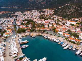 Fototapeta na wymiar Picturesque aerial view of coastal area and marina in Kas township in Antalya Province of Turkey during sundown