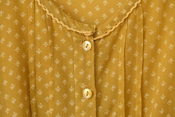 Full frame of Buttons down shirt.close up.