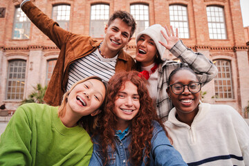 Close up portrait of a group of friends having fun and smiling together. High school students...