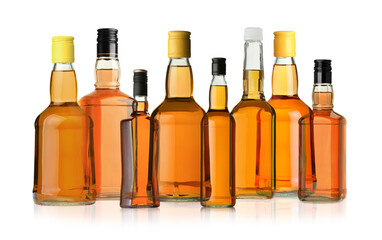 Many bottles of whiskey isolated on white, set