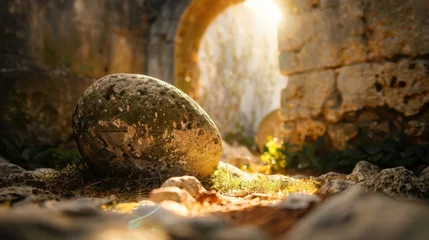 Foto auf Alu-Dibond A close-up shot of a weathered stone rolled away from a tomb, sunlight streaming through the opening  © kamonrat