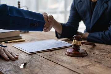Law and justice concept, businessman shaking hands with lawyer to seal agreement with lawyer,...