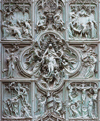 MILAN, ITALY - SEPTEMBER 16, 2024: The detail from main bronze gate of the Cathedral -   Deposition (Pieta) by Ludovico Pogliaghi (1906). - 767524323