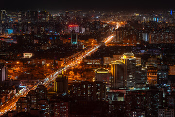 Beijing city night scene with busy traffic on the road in the city