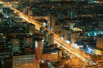 Night view of Beijing city with bustling traffic on the road