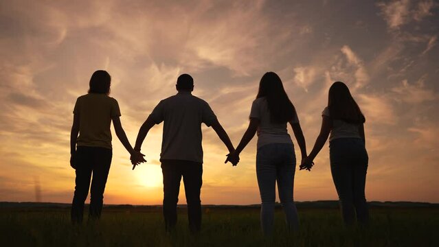 team people silhouette a holding hands. teamwork business together concept. group collective silhouette people hold together go to the goal joined hands. business people teamwork lifestyle