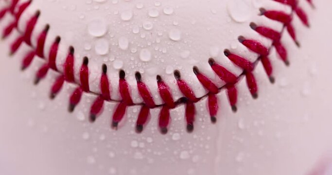 white baseball ball tied with red thread, a real round baseball ball close-up