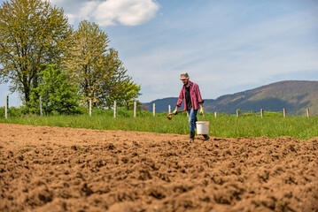 Male farmer working on an agricultural fields.