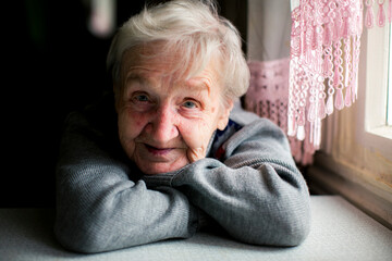 Portrait of elderly woman in the his house. - 767543330
