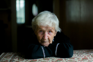 Portrait of an elderly woman in reflection.