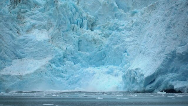 Glacier collapsing into sea water