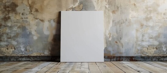 White canvas frame leaning against a concrete wall and wooden floor, perfect for inserting your own design with a mock-up template. - obrazy, fototapety, plakaty