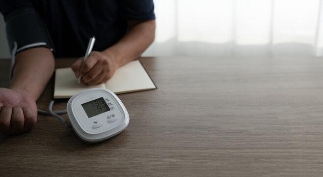 man checking blood pressure Health check blood pressure and heart rate at home