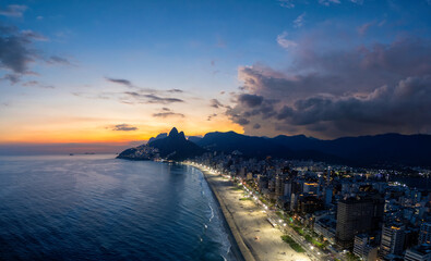 Sunset on Ipanema Beach with Dois Irmaos mountains in Rio de Janeiro, Brazil. Aerial view	 - 767553766