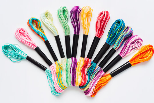 Many skeins of mouline thread for embroidery melange background