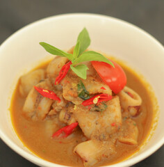 Top view. Selective focus. Cumi Rica Rica, squid cuisine with red and spicy sambal. Indonesian food.

