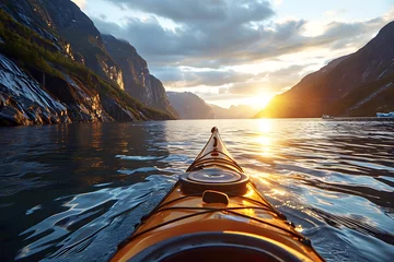 Foto op Canvas yellow kayak boat floats down the river in the fjords of Norway towards the sunrise. view from myself © photosaint