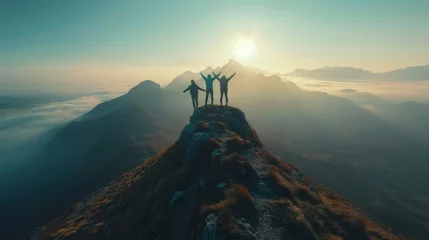 Foto op Aluminium Together overcoming obstacles with three people holding hands up in the air on mountain top , celebrating success and achievements © SHI