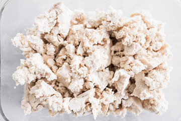 tofu chunks in glass container, close-up shot