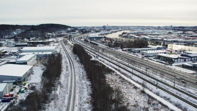 Snow-covered European route E45 just outside Gothenburg, aerial view of winter traffic