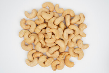 Heap of delicious cashew nuts isolated background