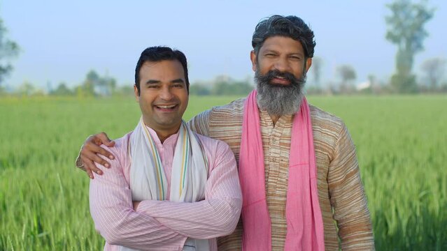 Two desi villagers laughing together on camera - desi lifestyle  desi farmers  agriculture  jai jawan jai kisan  annadata . Two Indian farmer brothers posing for camera - rural lifestyle  brothers ...