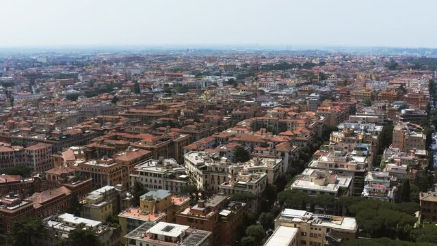 Aerial: Buildings And Green Trees In City Against Sky On Sunny Day - Rome, Italy