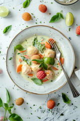 a delicious dish of green curry coconut chicken, accompanied by an exquisite lychee and lime sauce, top view, food commercial, menu card