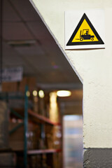 Warning, sign and forklift with triangle or symbol for alert, precaution or safety at warehouse or...