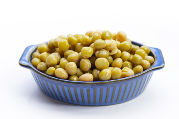 Canned green peas on white background.