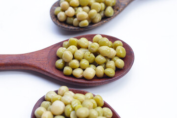 Canned green peas on white background.