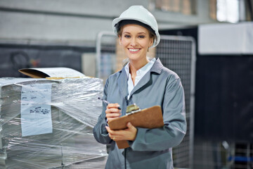 Logistics, portrait and woman in warehouse with clipboard for quality control, inventory or freight distribution. Hardhat, inspector or wholesale supplier with stock checklist or smile for inspection