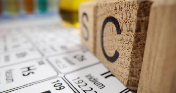 Liquids in flasks on table of chemical elements in clinic