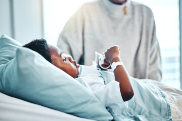 Medical, sick and child in bed in hospital for recovery of surgery, illness or diagnosis....