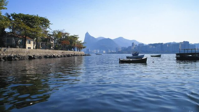 Point of view from a boat at the Praia da Urca, a popular tourist attraction in Rio de Janeiro. The Corcovado Mountain is in the background.