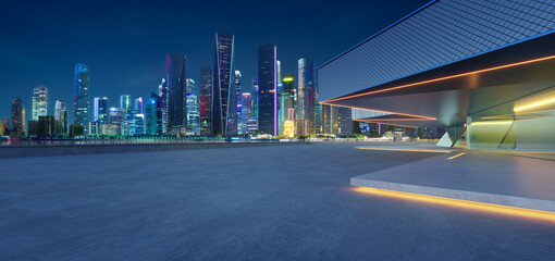 Fototapeta premium 3D Modern cityscape with illuminated skyscrapers at twilight