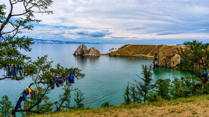 View to Baikal lake with Burkhan cape and Shamanka rock in Maloe More or Small Sea at Olkhon island. Beautiful summer landscape with natural landmark. Famous place, pilgrimage site. Siberia, Russia