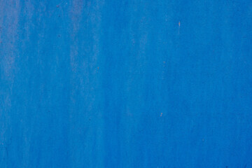 rough blue matte paint on flat sheet metal surface - full-frame background and texture.