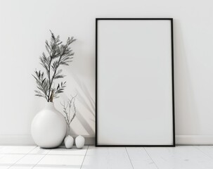 a blank white vertical picture frame leaning against a white wall - poster mockup template