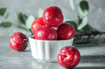 Free sweet red plums on dark background