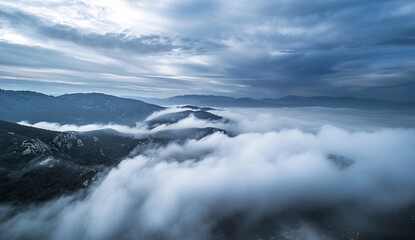 Naklejka premium clouds over the mountains