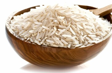 A bowl of white rice is sitting on a wooden table