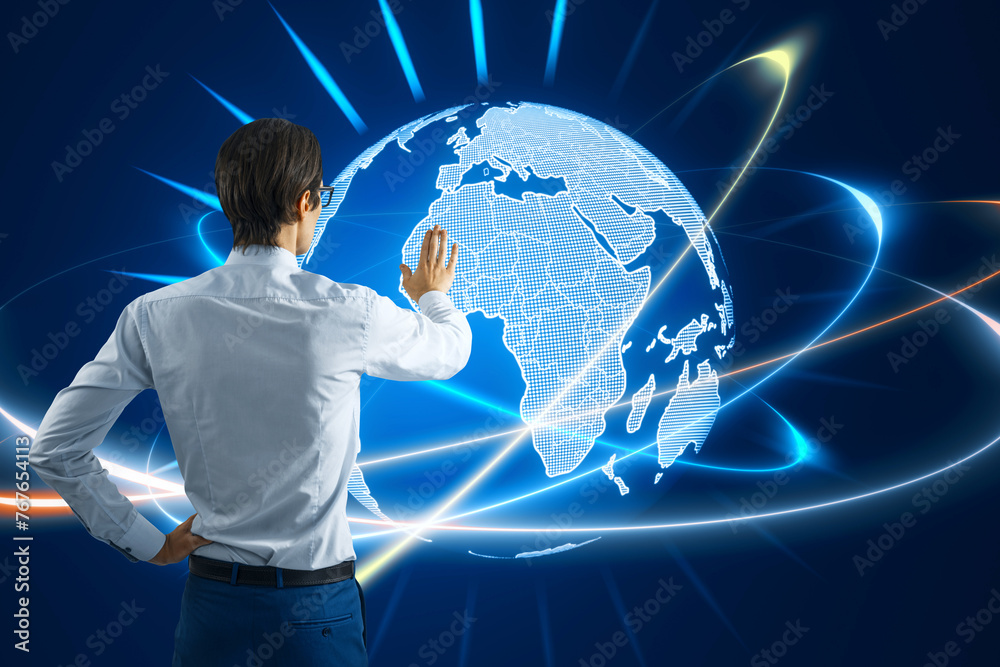 Poster back view of young man using glowing futuristic blue globe hologram on blurry background. digital in