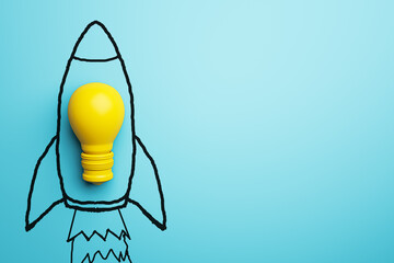 Creative spaceship sketch and yellow lamp on blue background with mock up place. Start up, new...