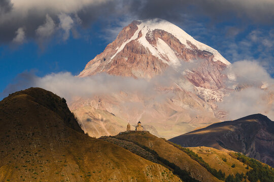View of Kazbek from the surrounding towns. The huge peak bathed in the morning sun is impressive.