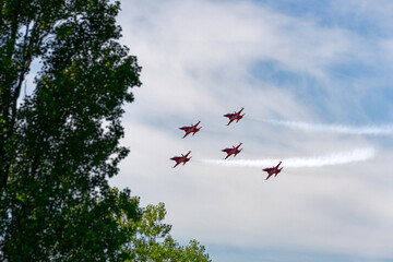 Patrouille Suisse doing aerobatics at Swiss Army exhibition at training ground of Swiss City of Kloten on a sunny summer day. Photo taken August 18th, 2023, Zurich Kloten, Switzerland.