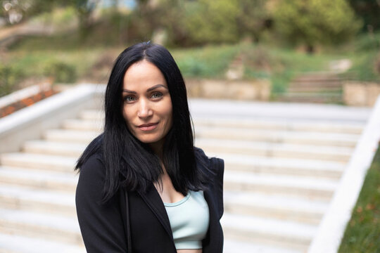 Portrait of smiling woman in park