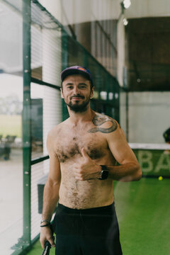 Man play padel tennis on an indoor court, Bali.