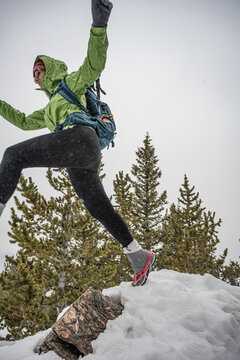 Woman jumps in the snow