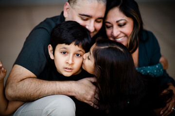 Sister Kisses Autistic Brother, Parents Look On in San Diego